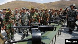 In this photo taken on March 17, 2018, Major General Zhang Jian, commander of the Chinese People's Liberation Army Southern Theatre Command, and Pol Saroeun, commander-in-chief of the Cambodian military, attend the opening of military exercise in Kampong Speu province, Cambodia.