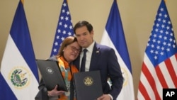 U.S. Secretary of State Marco Rubio, right, and El Salvador's Foreign Minister Alexandra Hill Tinoco pose for a photo after signing a memorandum of understanding in San Salvador, El Salvador, Feb. 3, 2025.