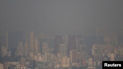 Buildings are pictured shrouded in smog in Mexico City, Mexico, May 5, 2016.