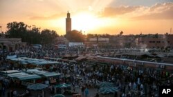 FILE - In this Nov. 5, 2016 file photo, people gather in the landmark Jemaa el-Fnaa square, in Marrakesh, Morocco.