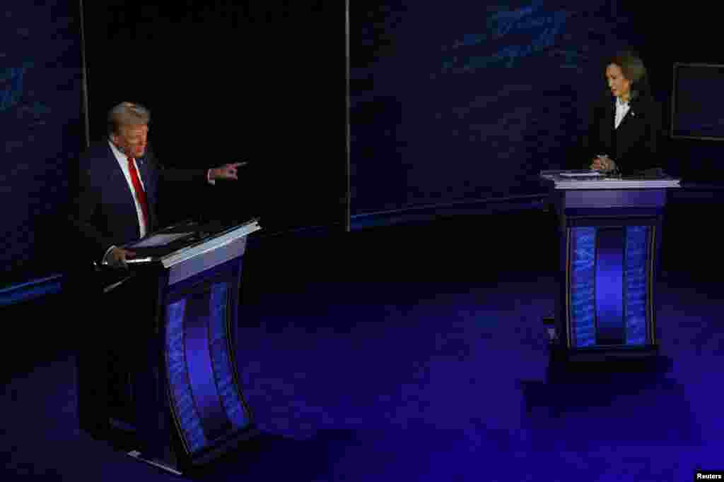 Republican presidential nominee, former U.S. President Donald Trump speaks as Democratic presidential nominee, Vice President Kamala Harris listens as they attend a presidential debate hosted by ABC in Philadelphia, Pennsylvania, Sept. 10, 2024.&nbsp;