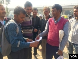 Ishwari Lal, who works at a construction site, has been told by his building contractor that he will pay his wages in a bank account due to currency shortages.