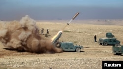  Members of the Iraqi rapid response forces fire a missile toward Islamic State militants during a battle in south of Mosul, Iraq, Feb. 19, 2017.