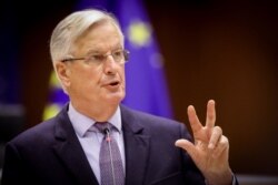 FILE - Michel Barnier delivers a speech during the debate on EU-UK trade and cooperation agreement at the European Parliament in Brussels, Apr. 12, 2021. (Oliver Hoslet/pool/AFP)