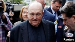 FILE - Archbishop Philip Wilson leaves Newcastle Local Court, in Newcastle, Australia, July 3, 2018. 