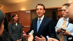With his wife Mary at his side, likely Republican presidential hopeful, former Minnesota Gov. Tim Pawlenty speaks with reporters in Lebanon, N.H, March 11, 2011