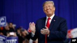 U.S. President Donald Trump arrives to speak at a campaign rally at Atlantic Aviation in Moon Township, Pennsylvania, March 10, 2018.