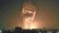 A social media image purportedly shows flames and smoke from an explosion rising into the night sky in Tianjin, China.