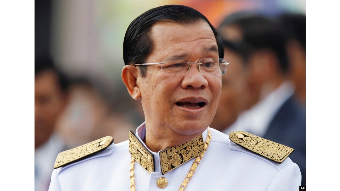 FILE - Cambodia's Prime Minister Hun Sen waits to attend Independence Day celebrations in Phnom Penh, Cambodia, Nov. 9, 2017.