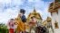 People visit the Grand Palace in Bangkok on June 7, 2020, as it reopened for visitors following restrictions to halt the spread of the COVID-19.