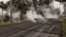 Steam rises from fissure 9 on Moku Street in the Leilani Estates Subdivision, Hawaii, May 7, 2018. HVO scientists on the scene reported hearing rumbling noises in the area.