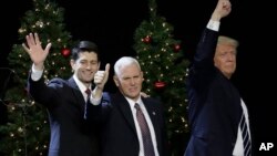 President-elect Donald Trump, Vice-President-elect Mike Pence and House Speaker Paul Ryan wave at a rally Tuesday, Dec. 13, 2016, in West Allis, Wisconsin. (AP Photo/Morry Gash)