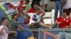 FILE - In this Saturday, June 11, 2016 file photo, Russian supporters attack an England fan at the end of the Euro 2016 Group B soccer match between England and Russia, at the Velodrome stadium in Marseille, France. 