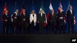 From left, Head of Mission of People's Republic of China to the European Union Hailong Wu, French Foreign Minister Laurent Fabius, German Foreign Minister Frank Walter Steinmeier, European Union High Representative for Foreign Affairs and Security Policy Federica Mogherini, Iranian Foreign Minister Javad Zarifat, an unidentified Russian official, British Foreign Secretary Philip Hammond and US Secretary of State John Kerry arrive, at the Swiss Federal Institute of Technology, or Ecole Polytechnique Federale De Lausanne, in Lausanne, Switzerland, Thursday, April 2, 2015, after Iran nuclear program talks finished with extended sessions. The United States, Iran and five other world powers on Thursday announced an understanding outlining limits on Iran's nuclear program so it cannot lead to atomic weapons, directing negotiators toward achieving a comprehensive agreement within three months. (AP Photo/Brendan Smialowski, Pool)