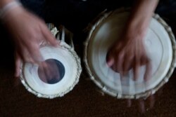 FILE - In this May 11, 2010 file photo, a student learns to play the tabla at the Afghan National Institute of Music, ANIM, in Kabul, Afghanistan.