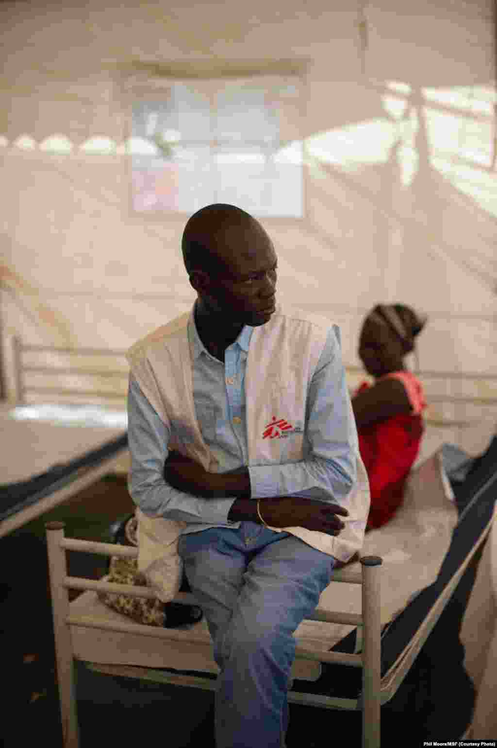 A medic sits in the in-patient department of the MSF clinic set up at the camp for displaced people in the grounds of the United Nations Mission to South Sudan (UNMISS) base in Juba, South Sudan, on January 12, 2014.