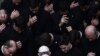 Pope Francis prays with priests at the end of a limited public audience at the San Damaso courtyard at the Vatican, Sept. 30, 2020.