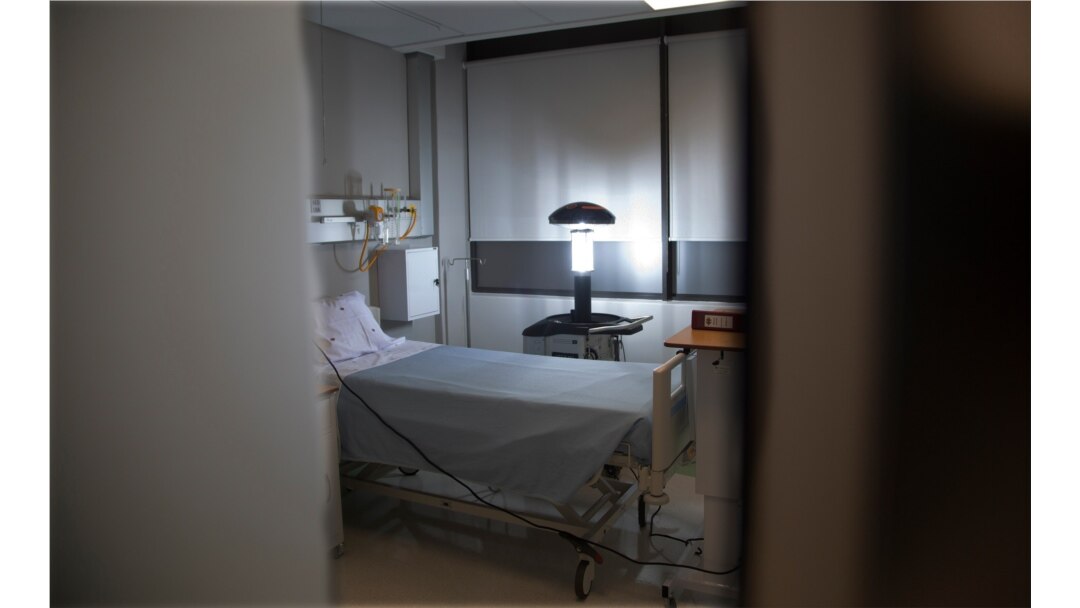 A robotic pulsating UV machine sterilizes a consulting room at the Milpark Hospital in Johannesburg, March 11, 2020 as a precaution against the new coronavirus.