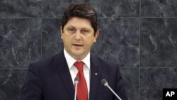 FILE - Romanian Foreign Minister Titus Corlatean speaks during the 68th session of the General Assembly at United Nations headquarters.