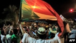 FILE - Demonstrators gather outside the army headquarters in Sudan's capital Khartoum on May 11, 2021, on the hijri-date anniversary of the killing of Sudanese protesters during a raid on an anti-government sit-in in 2019.