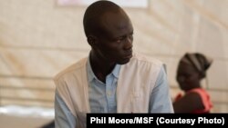 A medic sits in the in-patient department of the MSF clinic set up at the camp for displaced people in the grounds of the United Nations Mission to South Sudan (UNMISS) base in Juba, South Sudan, on January 12, 2014.