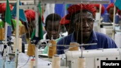 FILE - Kenyan workers prepare clothes for export at the United Aryan Export Processing Zone (EPZ) factory, operating under the U.S. African Growth and Opportunity Act (AGOA), in Ruaraka district of Nairobi, Kenya October 26, 2023.