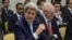 US Secretary of State John Kerry (L) gestures waiting for the opening of a plenary session with P5+1 ministers, European Union and Iranian minister on Iran nuclear talks at the Beau Rivage Palace Hotel in Lausanne, Switzerland, March 31, 2015.
