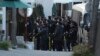 Police arrive at the gate of the presidential residence as supporters of impeached South Korean President Yoon Suk Yeol rally against a court's issuance of a warrant to detain Yoon, in Seoul, South Korea, Jan. 3, 2025. 