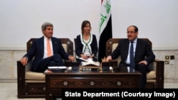 Secretary Kerry sits with Iraqi Prime Minister al-Maliki before meeting in Baghdad, June 22-27, 2014.