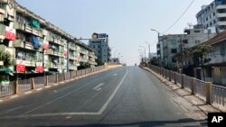 A main roadway sits empty in Mandalay, central Myanmar, Feb.1, 2022.