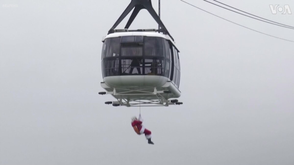 Extreme Santa Zip-Lines Down Rio's Iconic Sugarloaf Mountain