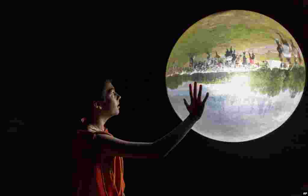 A boy looks at a glass bowl in a museum in Bramsche-Kalkriese, Germany.