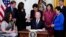 BidenPresident Joe Biden hands out a pen after signing the COVID-19 Hate Crimes Act, in the East Room of the White House, Thursday, May 20, 2021, in Washington. Clockwise from left, Sen. Tammy Duckworth, R-Ill., Sen. Richard Blumenthal, D-Conn., Vice Pres