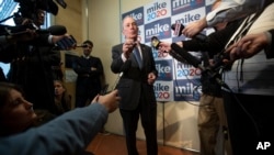 FILE - Democratic presidential candidate Michael Bloomberg speaks to reporters after a campaign event, in Burlington, Vermont, Jan. 27, 2020.