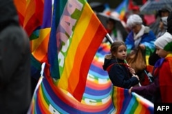 People gather in Milan, Italy, for a demonstration for peace in Middle East and Ukraine, Oct. 26, 2024.