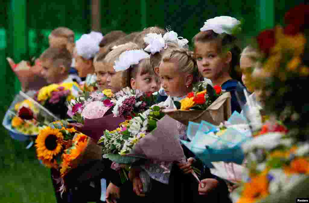First graders attend a ceremony marking the start of the new school year, as schools reopen after the summer break and the lockdown due to the outbreak of the coronavirus disease (COVID-19), in Moscow, Russia.