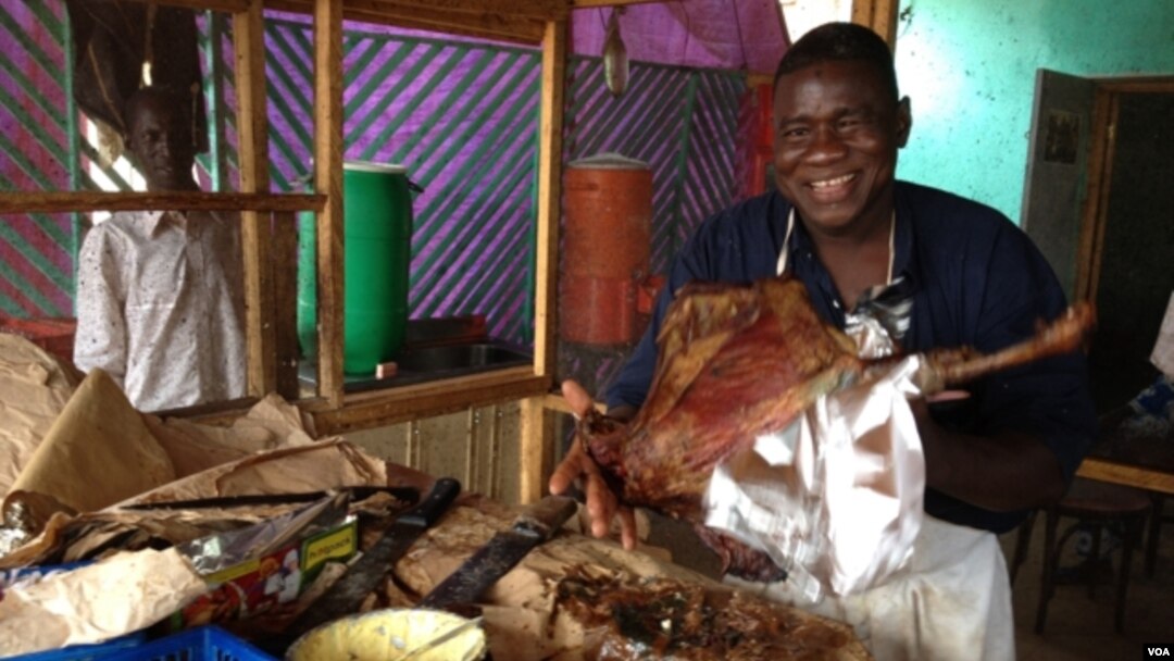 Restaurant owner, Bella Tandina, Dr. One Close, credits the success of his rotisserie to the superior quality of his cooking, his upbeat disposition, witty repartee with customers, which he calls his one-man marketing efforts. (Anne Look/VOA)