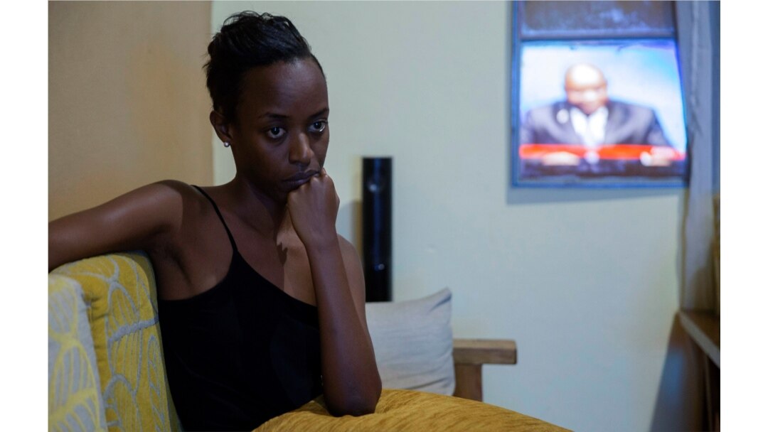 A resident watches a television broadcasting the death of President Pierre Nkurunziza in Bujumbura, Burundi, June 9, 2020. His sudden death came as a shock to everyone on the African political scene.