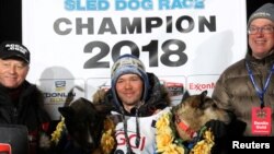 Joar Leifseth Ulsom of Norway celebrates winning the Iditarod Trail Sled Dog Race, the annual 1,000-mile (1609-km) trek across Alaska's wilderness, in Nome, Alaska, U.S., March 14, 2018. 