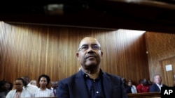 FILE- Former Mozambican finance minister, Manuel Chang, in court in Kempton Park, Johannesburg, South Africa, Tuesday Jan. 8, 2019. Chang appeared in court following a U.S. extradition request in connection with an alleged dollar 2 billion fraud scheme. 