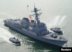 FILE - The USS Mason, which carries an array of advanced weaponry, including the Aegis anti-air warfare missile system, arrives at Port Canaveral, Florida, April 4, 2003.