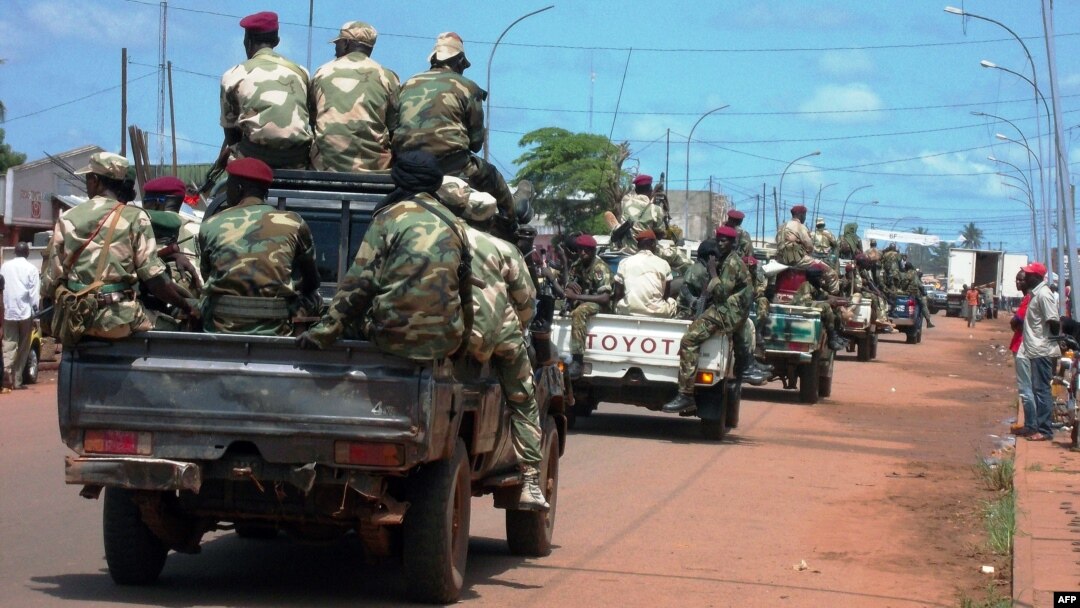 FILE - Central African troops in charge of disarmament drive a tank through Bangui, Central African Republic.