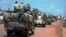 FILE - Central African troops in charge of disarmament drive a tank through Bangui, Central African Republic.