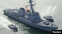 FILE - The USS Mason arrives at Port Canaveral, Florida.