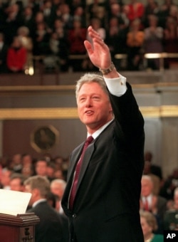 FILE - President Bill Clinton waves prior to giving his State of the Union address, Jan. 23, 1996 on Capitol Hill.
