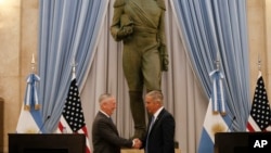 U.S. Secretary of Defense Jim Mattis, left, and Argentina's Defense Minister Oscar Raul Aguad shake hands in Buenos Aires, Argentina, Aug. 15, 2018. Mattis is on an official visit to several South American countries. 