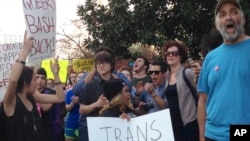 FILE - People protest outside the North Carolina Executive Mansion in Raleigh, N.C. A North Carolina proposal to forbid transgender people from using restrooms that correspond to their gender identity is part of a backlash by lawmakers across the historic South.