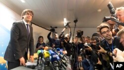 Deposed Catalan president Carles Puigdemont is seen after wrapping up a press conference in Brussels, Belgium, Oct. 31, 2017.