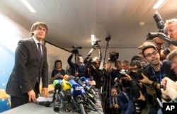 Deposed Catalan president Carles Puigdemont is seen after wrapping up a press conference in Brussels, Belgium, Oct. 31, 2017.