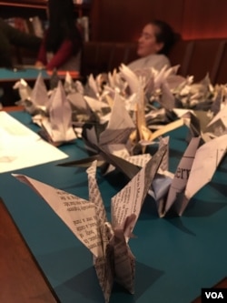 Participants in the 2,300 paper cranes folding event​ at Radical Library inside Eaton DC, Washington DC, on November 18, 2018. (Say Mony/VOA Khmer)